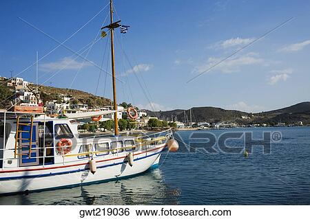 Yacht moored at a harbor, Skala, Patmos, Dodecanese Islands, Greece View Large Photo Image Stock Photograph - Yacht moored at a harbor, Skala, Patmos, Dodecanese Islands, Greece. Fotosearch