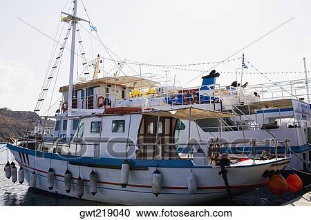 Stock Image - Yachts moored at a harbor, Skala, Patmos, Dodecanese Islands, Greece. Fotosearch