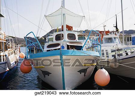 Yachts moored at a harbor, Skala, Patmos, Dodecanese Islands, Greece View Large Photo Image Stock Image - Yachts moored at a harbor, Skala, Patmos, Dodecanese Islands, Greece. Fotosearch