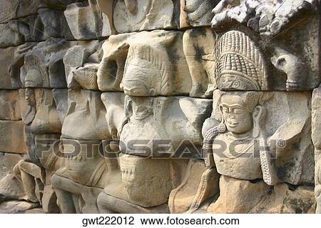 Close-up of sculptures carved on the wall of a temple, Angkor Wat, Siem Reap, Cambodia View Large Photo Image Stock Image - Close-up of sculptures carved on the wall of a temple, Angkor Wat, Siem Reap, Cambodia. Fotosearch