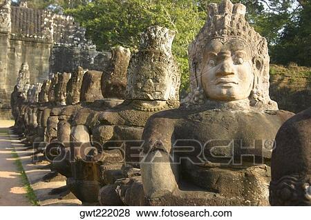 Close-up of statues in a row, Ta Prohm Temple, Angkor Wat, Siem Reap, Cambodia View Large Photo Image Stock Photo - Close-up of statues in a row, Ta Prohm Temple, Angkor Wat, Siem Reap, Cambodia. Fotosearch