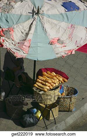 High angle view of a man selling breads, Vientiane, Laos View Large Photo Image Stock Photo - High angle view of a man selling breads, Vientiane, Laos. Fotosearch
