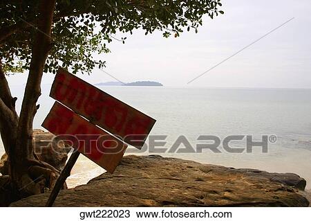 Stock Image - Information board at the seaside, Sihanoukville, Cambodia. Fotosearch