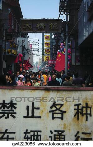 Group of people in a street market, Beijing, China View Large Photo Image Stock Photograph - Group of people in a street market, Beijing, China. Fotosearch