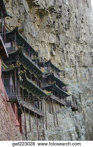 Low angle view of buildings on a mountain, Yungang Buddhist Caves, China View Large Photo Image Stock Photo - Low angle view of buildings on a mountain, Yungang Buddhist Caves, China. Fotosearch