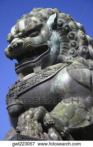 Low angle view of the statue of a lion, Forbidden City, Beijing, China View Large Photo Image Stock Photo - Low angle view of the statue of a lion, Forbidden City, Beijing, China. Fotosearch