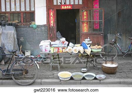 Stock Photograph - Market stall in front of a door, Pingyao, Shaanxi Province, China. Fotosearch