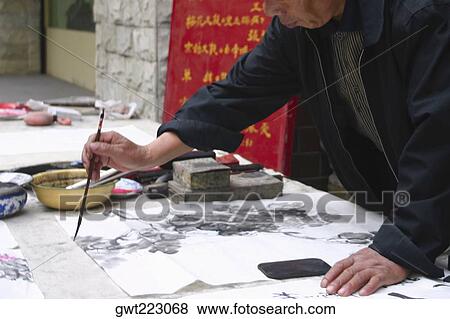 Mid section view of a man calligraphing, Beijing, China View Large Photo Image Stock Photo - Mid section view of a man calligraphing, Beijing, China. Fotosearch
