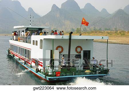 Tourists on a tourboat, Li River, Guilin, China View Large Photo Image Picture - Tourists on a tourboat, Li River, Guilin, China. Fotosearch