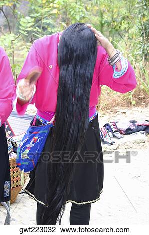 Woman combing her hair, Longsheng, China View Large Photo Image Stock Image - Woman combing her hair, Longsheng, China. Fotosearch