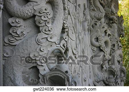 Stock Photograph - Close-up of carving on a wall, Po Lin Monastery, Ngong Ping, Lantau, Hong Kong, China. Fotosearch