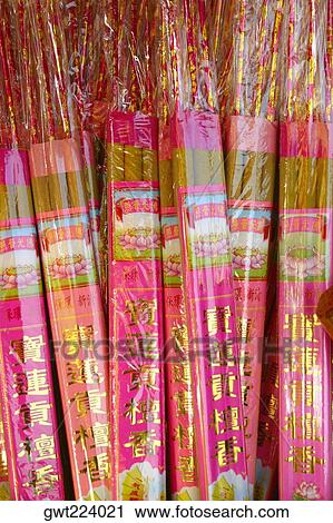 Stock Image - Close-up of packets of incense sticks, Po Lin Monastery, Ngong Ping, Lantau, Hong Kong, China. Fotosearch
