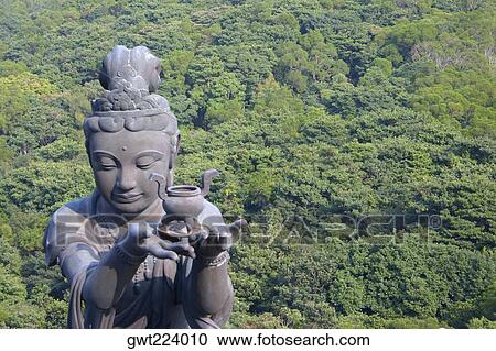 Stock Image - High angle view of a Buddhist statue, Tian Tan Buddha, Po Lin Monastery, Ngong Ping, Lantau, Hong Kong, China. Fotosearch