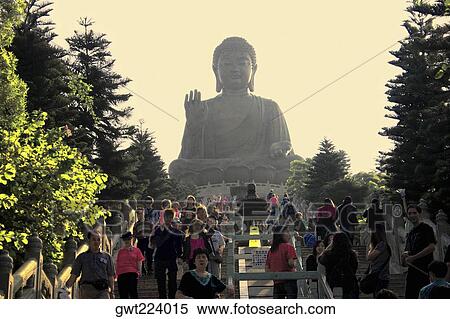Low angle view of tourists visiting a monastery, Tian Tan Buddha, Po Lin Monastery, Ngong Ping, Lantau, Hong Kong, China View Large Photo Image Stock Photography - Low angle view of tourists visiting a monastery, Tian Tan Buddha, Po Lin Monastery, Ngong Ping, Lantau, Hong Kong, China. Fotosearch
