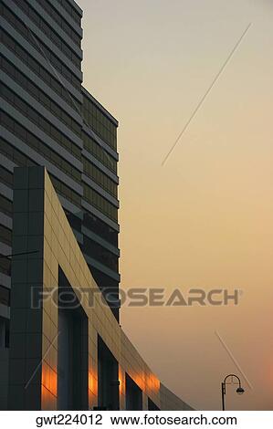 Stock Image - Reflection of sunlight on a building, City Centre, Kowloon, Hong Kong, China. Fotosearch