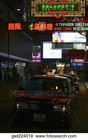Stock Photo - Taxi parked in a row in a market, Kowloon, Hong Kong, China. Fotosearch