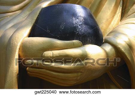 Close-up of a statue holding a bowl, Vientiane, Laos View Large Photo Image Stock Image - Close-up of a statue holding a bowl, Vientiane, Laos. Fotosearch