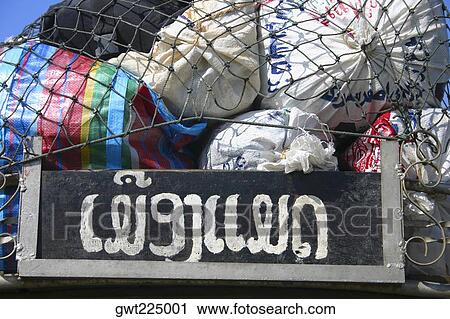Close-up of bags loaded on top of a land vehicle, Vang Vieng, Laos View Large Photo Image Stock Image - Close-up of bags loaded on top of a land vehicle, Vang Vieng, Laos. Fotosearch