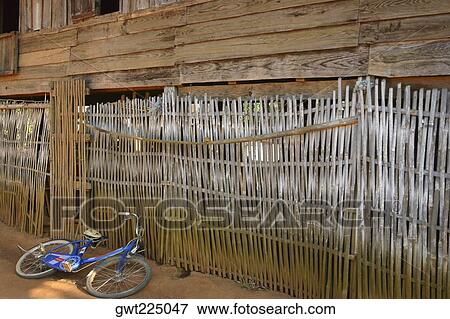 High angle view of a bicycle near a fence, Luang Prabang, Laos View Large Photo Image Stock Photo - High angle view of a bicycle near a fence, Luang Prabang, Laos. Fotosearch