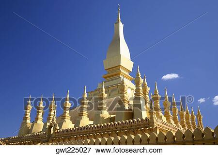 Stock Photo - Low angle view of a temple, Buddhist temple, That Luang, Vientiane, Laos. Fotosearch