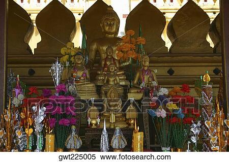 Stock Photography - Statues of Buddha in a temple, Buddhist temple, That Luang, Vientiane, Laos. Fotosearch