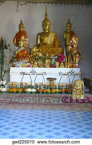 Statues of Buddha in a temple, That Luang, Vientiane, Laos View Large Photo Image Stock Image - Statues of Buddha in a temple, That Luang, Vientiane, Laos. Fotosearch