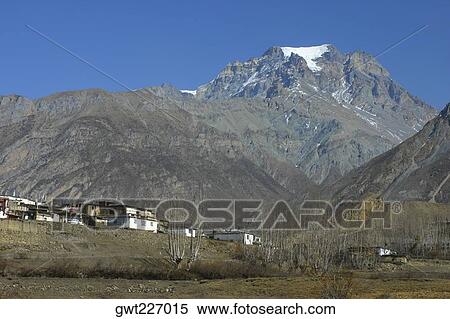 Houses in front of a mountain, Annapurna Range, Himalayas, Nepal View Large Photo Image Stock Photography - Houses in front of a mountain, Annapurna Range, Himalayas, Nepal. Fotosearch