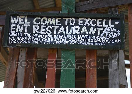 Stock Photograph - Low angle view of an information board of a restaurant, Doban, Annapurna Range, Himalayas, Nepal. Fotosearch