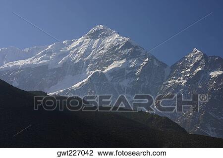 Panoramic view of a mountain range covered with snow, Annapurna Range, Himalayas, Nepal View Large Photo Image Stock Image - Panoramic view of a mountain range covered with snow, Annapurna Range, Himalayas, Nepal. Fotosearch