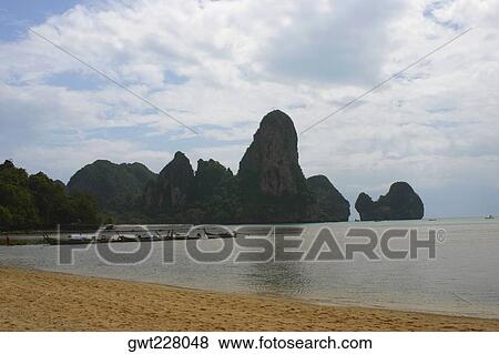 Cliffs along the sea, Phi Phi Islands, Thailand View Large Photo Image Stock Photo - Cliffs along the sea, Phi Phi Islands, Thailand. Fotosearch