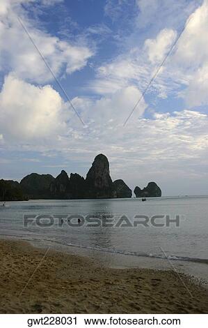 Stock Image - Cliffs along the sea, Thailand. Fotosearch