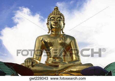 Low angle view of a statue of Buddha, Chiang Mai, Thailand View Large Photo Image Stock Image - Low angle view of a statue of Buddha, Chiang Mai, Thailand. Fotosearch