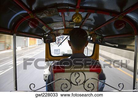 Rear view of a man driving a tuk-tuk, Bangkok, Thailand View Large Photo Image Stock Image - Rear view of a man driving a tuk-tuk, Bangkok, Thailand. Fotosearch