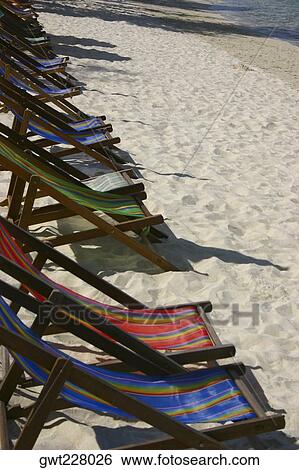 Reclining chairs on the beach, Phi Phi Islands, Thailand View Large Photo Image Stock Photograph - Reclining chairs on the beach, Phi Phi Islands, Thailand. Fotosearch