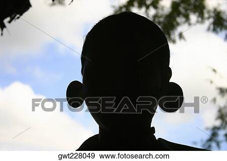 Silhouette of a statue, Chiang Khong, Thailand View Large Photo Image Stock Photo - Silhouette of a statue, Chiang Khong, Thailand. Fotosearch