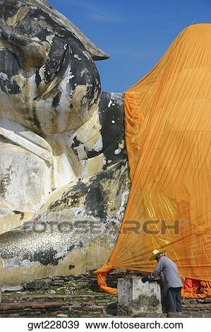 Stock Photo - Statue of Reclining Buddha in a temple, Wat Lokayasutharam, Ayutthaya Historical Park, Ayuthaya, Thailand. Fotosearch