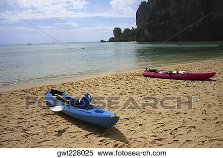 Two kayaks on the beach, Phi Phi Islands, Thailand View Large Photo Image Stock Photography - Two kayaks on the beach, Phi Phi Islands, Thailand. Fotosearch