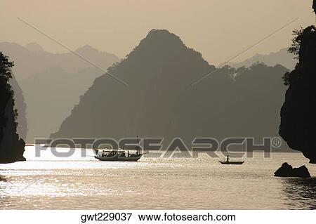 Boats in the sea, Halong Bay, Vietnam View Large Photo Image Stock Photo - Boats in the sea, Halong Bay, Vietnam. Fotosearch