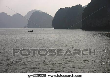 Islands in the sea, Halong Bay, Vietnam View Large Photo Image Stock Photography - Islands in the sea, Halong Bay, Vietnam. Fotosearch
