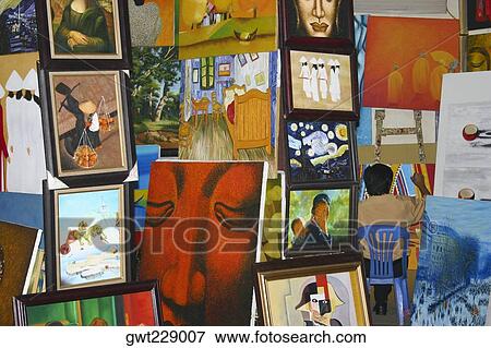 Stock Photo - Painter with his paintings, Hanoi, Vietnam. Fotosearch