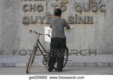 Rear view of a woman selling ice creams, Hanoi, Vietnam View Large Photo Image Stock Image - Rear view of a woman selling ice creams, Hanoi, Vietnam. Fotosearch