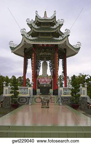 Stock Image - Statue of Buddha in a temple, Dong Hoi, Vietnam. Fotosearch