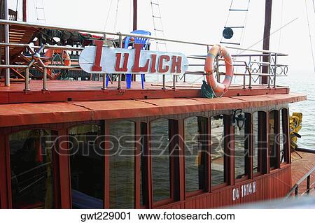 Tourboat in the sea, Halong Bay, Vietnam View Large Photo Image Stock Image - Tourboat in the sea, Halong Bay, Vietnam. Fotosearch