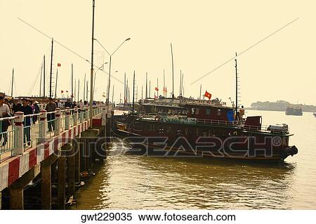 Stock Photography - Tourboats in a bay, Halong Bay, Vietnam. Fotosearch
