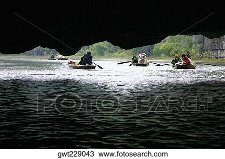 Tourists sitting in the boats, Dong Hoi, Vietnam View Large Photo Image Stock Image - Tourists sitting in the boats, Dong Hoi, Vietnam. Fotosearch