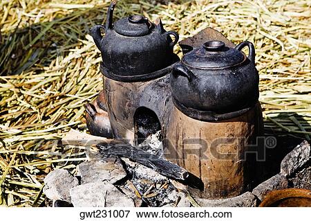 Close-up of two kettles on a oven, Uros Floating Islands, Puno, Peru View Large Photo Image Stock Photo - Close-up of two kettles on a oven, Uros Floating Islands, Puno, Peru. Fotosearch