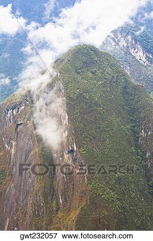 Clouds over mountains, Mt Putukusi, Cuzco, Peru View Large Photo Image Stock Photo - Clouds over mountains, Mt Putukusi, Cuzco, Peru. Fotosearch