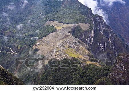 High angle view of ruins on mountains, Machu Picchu, Cusco Region, Peru View Large Photo Image Picture - High angle view of ruins on mountains, Machu Picchu, Cusco Region, Peru. Fotosearch