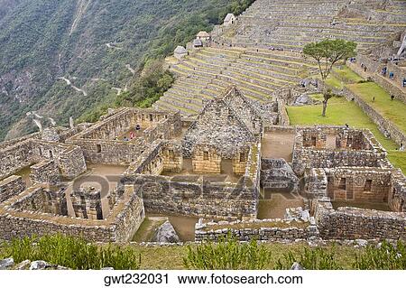 Stock Image - High angle view of ruins on mountains, Machu Picchu, Cusco Region, Peru. Fotosearch