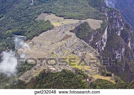 High angle view of ruins on mountains, Mt Huayna Picchu, Machu Picchu, Cusco Region, Peru View Large Photo Image Stock Photo - High angle view of ruins on mountains, Mt Huayna Picchu, Machu Picchu, Cusco Region, Peru. Fotosearch
